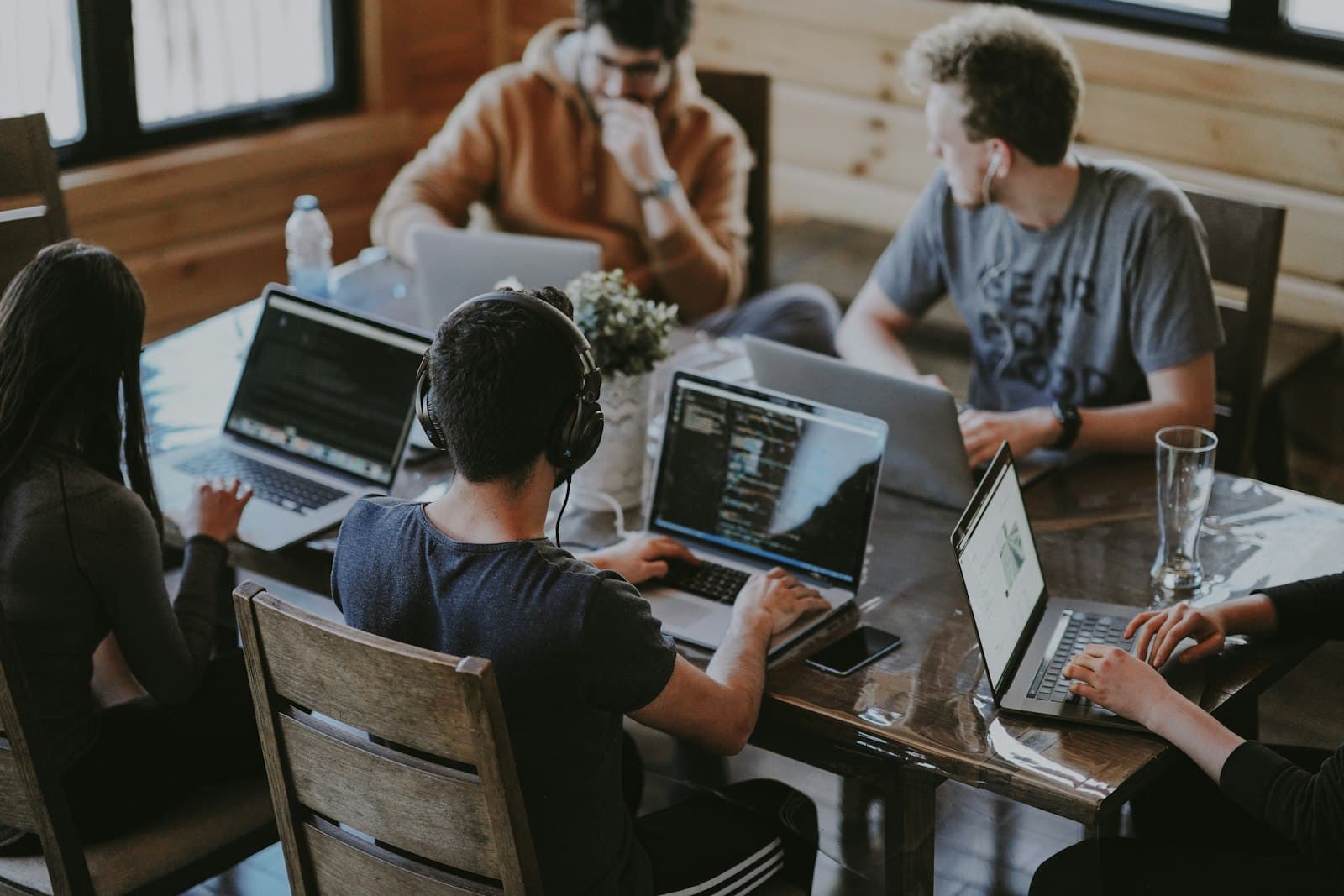 A team collaborating around a table in a bright modern workspace