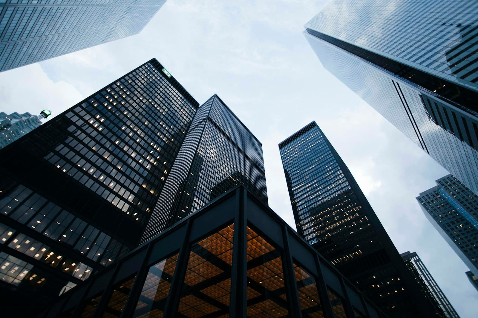 A glass-walled building reflecting the sky